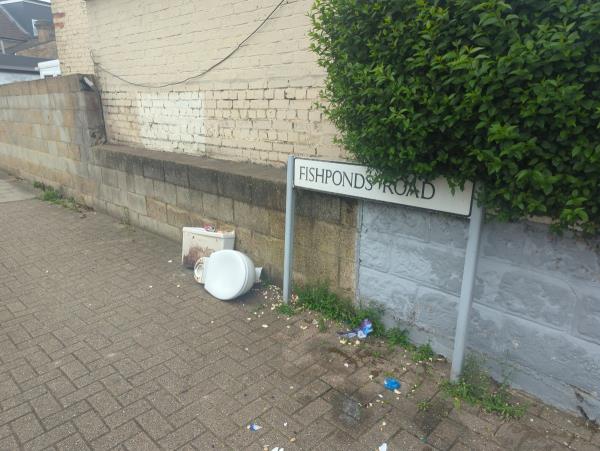 Toilet dumped on street.-156 Fishponds Road, London, SW17 7LE