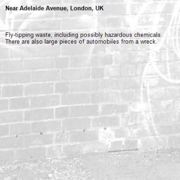 Fly-tipping waste, including possibly hazardous chemicals.  There are also large pieces of automobiles from a wreck.-Adelaide Avenue, London, UK