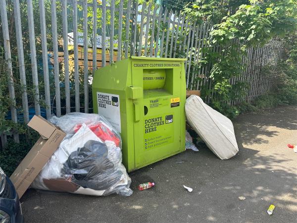 Mattress and other rubbish dumped by Traid bin-Apartment 1, 26 Gwynne Road, London, SW11 3HA
