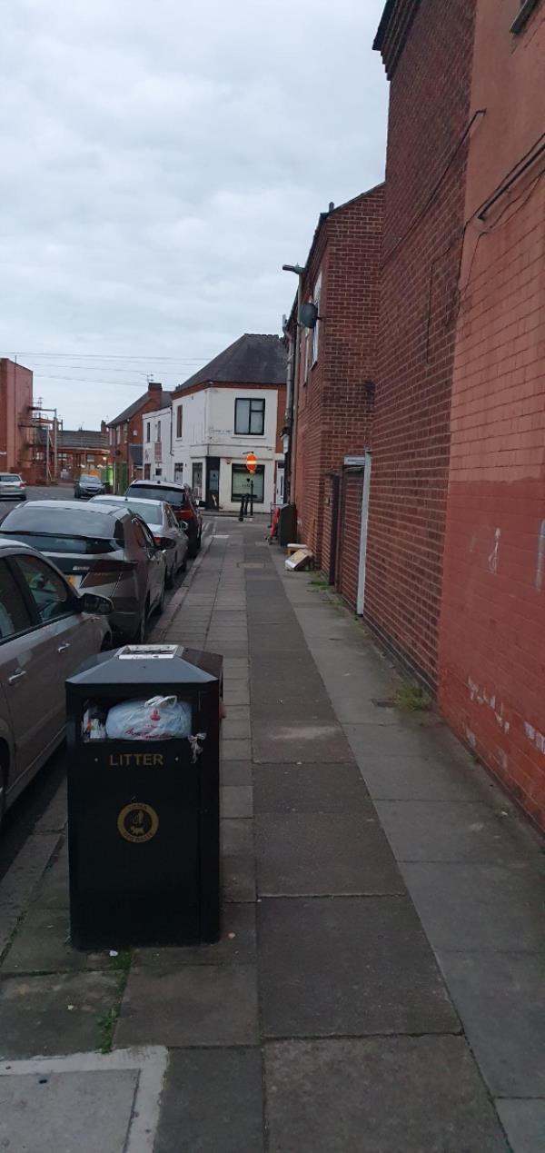 Public bin with household rubbish in recycling bags, shopping trolley, road block and furniture abandoned. 

Please let me know if you're aware and working to resolve so I don't keep sending these across:).-First Floor Flat, 8 Cross Street, Leicester, LE4 5BA