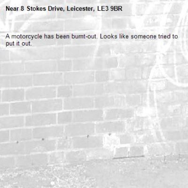 A motorcycle has been burnt-out. Looks like someone tried to put it out.-8 Stokes Drive, Leicester, LE3 9BR