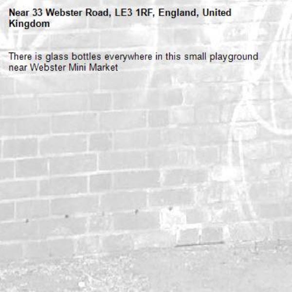There is glass bottles everywhere in this small playground near Webster Mini Market-33 Webster Road, LE3 1RF, England, United Kingdom
