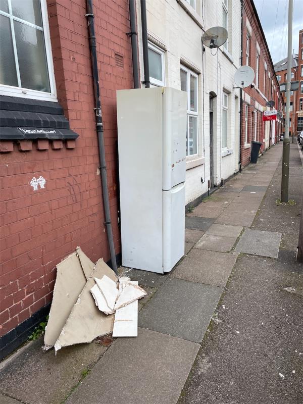Old fridge and broken plaster board left on pavement -43 Ullswater Street, Leicester, LE2 7DU
