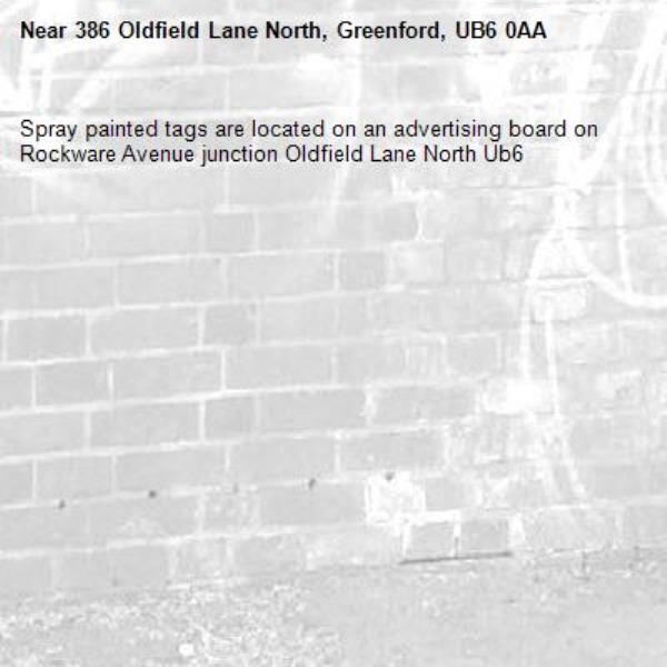 Spray painted tags are located on an advertising board on Rockware Avenue junction Oldfield Lane North Ub6 -386 Oldfield Lane North, Greenford, UB6 0AA