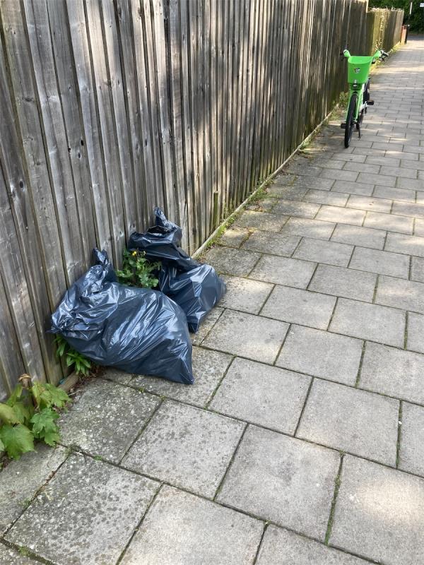 Black bags fly tipped -4 Garden Close, Grove Park, London, SE12 9TG