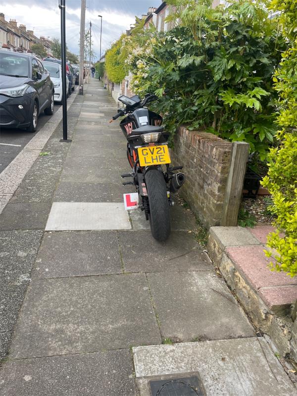 Pavement regularly blocked by motorbike outside 64-57 Glenfarg Road, London, SE6 1XN