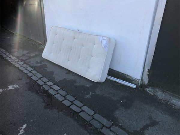 Service Road rear of shops. Please clear a mattress -28A, Randlesdown Road, Bellingham, London, SE6 3BT