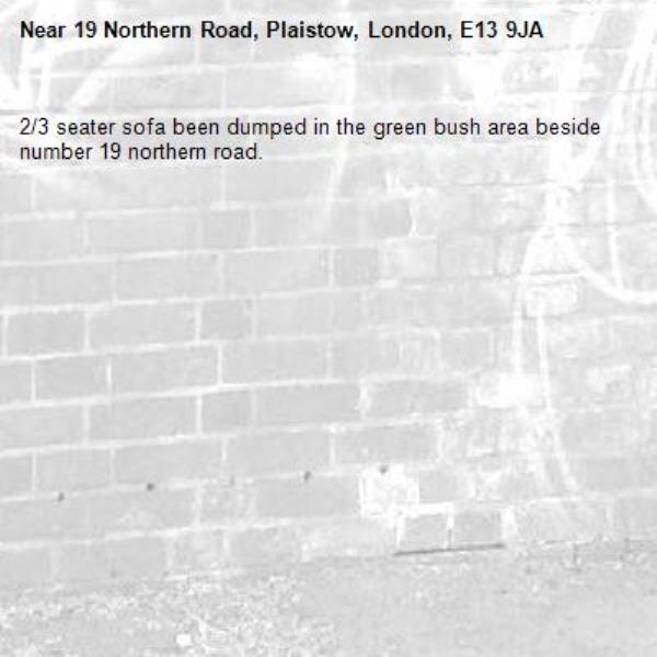 2/3 seater sofa been dumped in the green bush area beside number 19 northern road. -19 Northern Road, Plaistow, London, E13 9JA