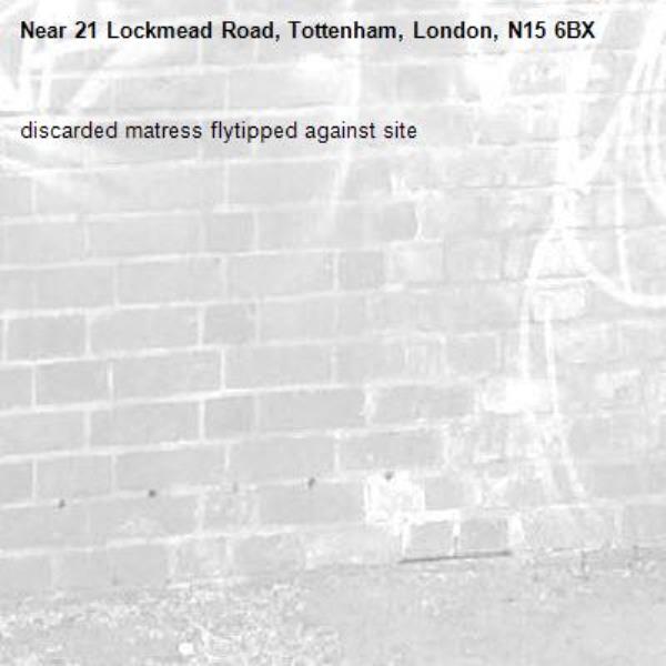 discarded matress flytipped against site-21 Lockmead Road, Tottenham, London, N15 6BX