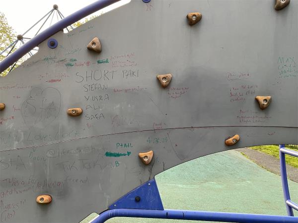 Racist graffiti in kids park on climbing wall-117 Chandos Road, Stratford, London, E15 1TU