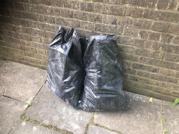 Side of 19 opposite Garages. Please clear two bags of builders waste-34 Riverpark Gardens, Bromley, BR2 0BH