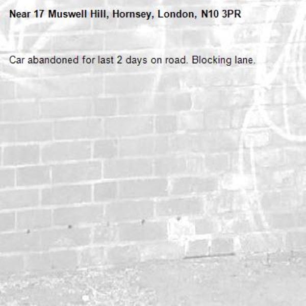 Car abandoned for last 2 days on road. Blocking lane.-17 Muswell Hill, Hornsey, London, N10 3PR