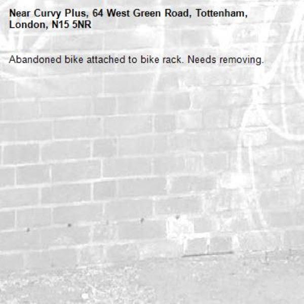 Abandoned bike attached to bike rack. Needs removing.-Curvy Plus, 64 West Green Road, Tottenham, London, N15 5NR