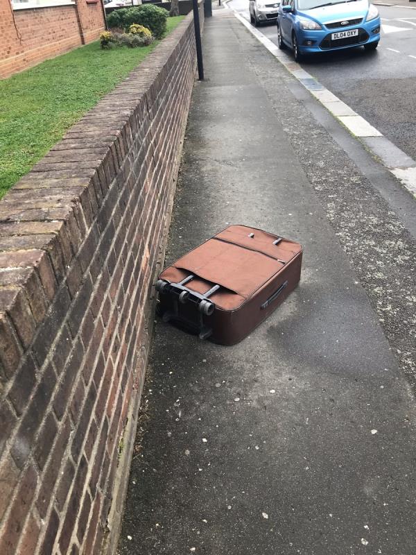 Old suitcase fly tipped on pavement opposite 100 Engleheart Road SE6 -79A, Engleheart Road, London, SE6 2HR