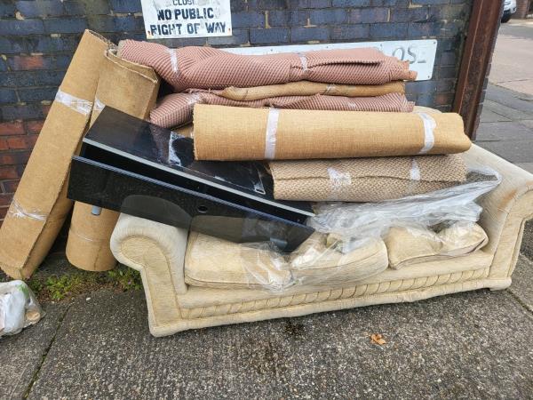 More fly tipping at this location. Since a previous report on 12/04 furniture and carpetting has been dumped too, this is now starting to impede access for elderly residents in the adjoining properties.-62 Babingley Drive, Leicester, LE4 0HJ