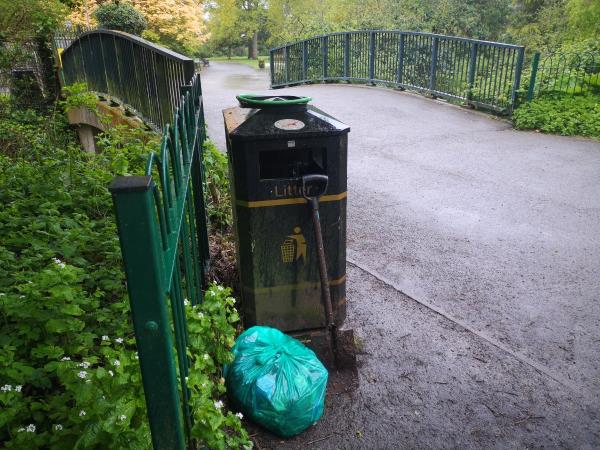 One bag mixed litter plus a spade left at bin on bridge next to ornamental garden -29 Woodbank Road, Leicester, LE2 3YQ