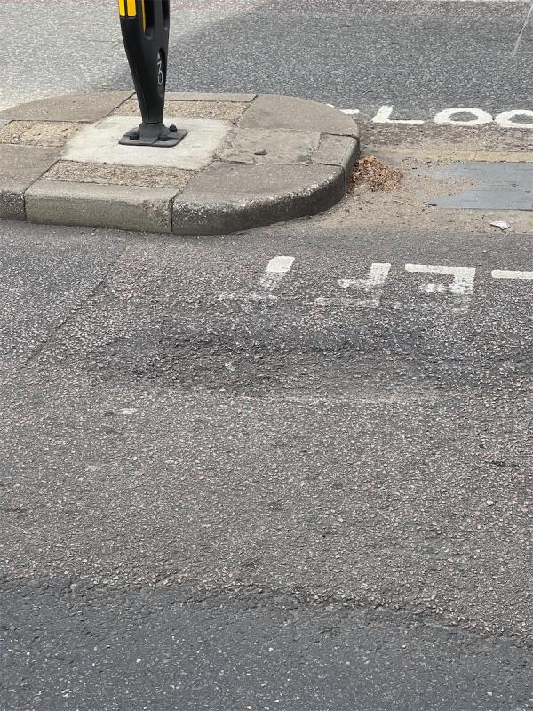 Large indentation. Dangerous for bikes and cars.-208A, Romford Road, Forest Gate, London, E7 9HY
