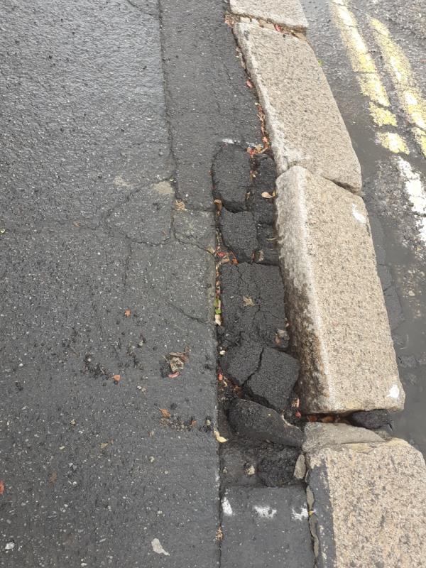 Depsite repairs, large curb block has come away and is in a dangerous position especially for pedestrians. -228 Ham Road, Worthing, BN11 2QJ