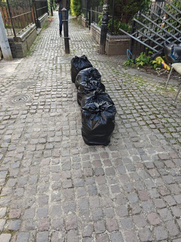 Bags left at the front of the avenue again. This is the second time I've reported it. Can you find out who's doing it?-1 College Avenue
