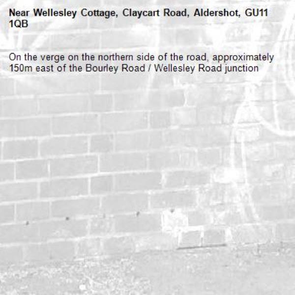 On the verge on the northern side of the road, approximately 150m east of the Bourley Road / Wellesley Road junction-Wellesley Cottage, Claycart Road, Aldershot, GU11 1QB