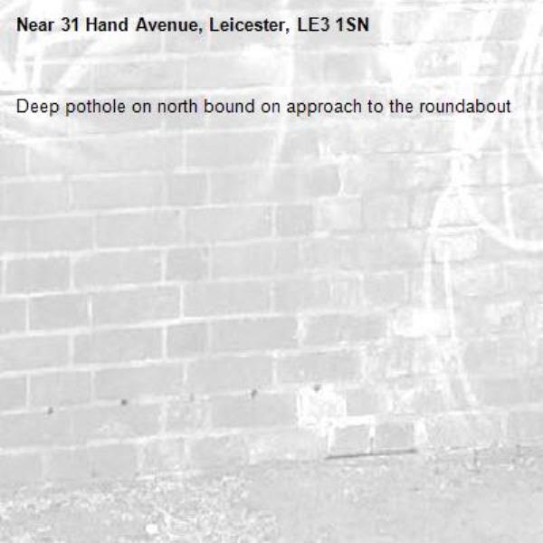 Deep pothole on north bound on approach to the roundabout-31 Hand Avenue, Leicester, LE3 1SN