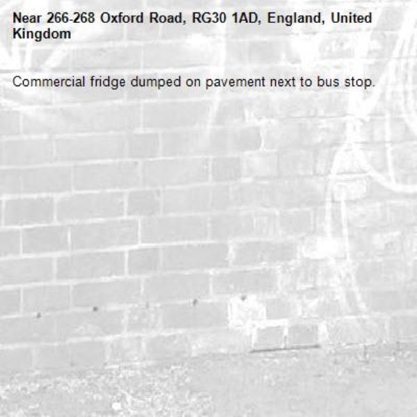 Commercial fridge dumped on pavement next to bus stop.-266-268 Oxford Road, RG30 1AD, England, United Kingdom