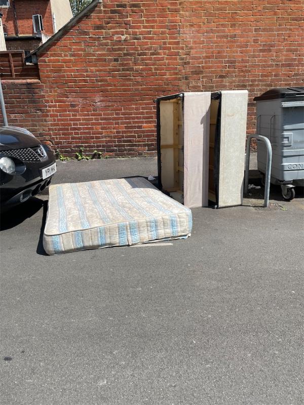 Fly tipped moving out rubbish, consisting of bed, base and mattress garden chair etc at the middle bins on Anstey Road. I will see if Residents got any site to deposit of the bed and get back to you-18 Anstey Road, Reading, RG1 7JR