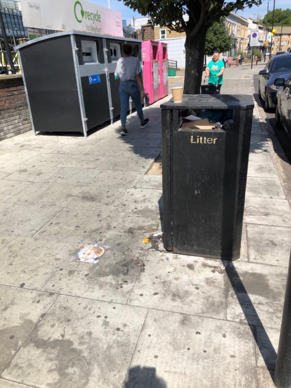 The bin and recycling bins outside Henniker point are full and overflowing and bin bags have been dumped next to them. -60 Leytonstone Road, London, E15 1SQ