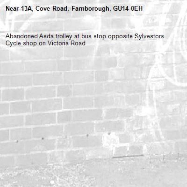 Abandoned Asda trolley at bus stop opposite Sylvestors Cycle shop on Victoria Road-13A, Cove Road, Farnborough, GU14 0EH