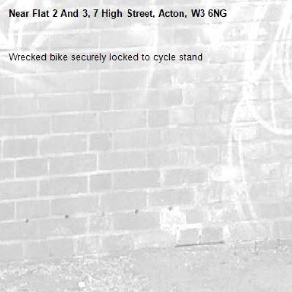 Wrecked bike securely locked to cycle stand -Flat 2 And 3, 7 High Street, Acton, W3 6NG