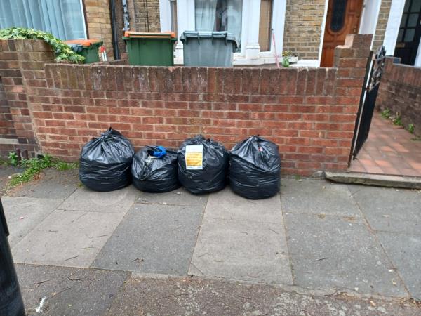 Bags of garden waste fly tipped at 11 Sutton Court Road, E13. -11 Sutton Court Road, Plaistow, London, E13 9NN