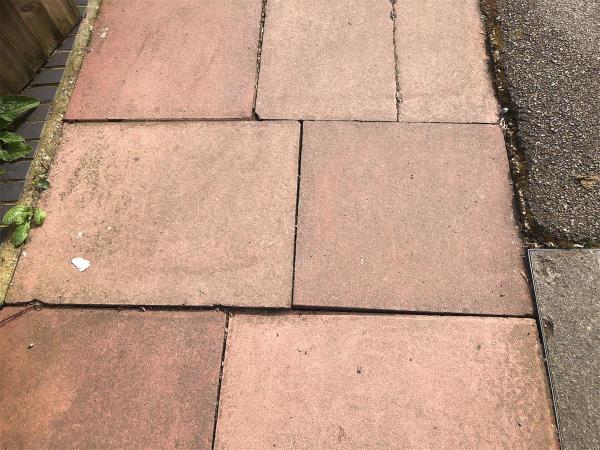 Outside no 426. Loose paving slabs-424 Bromley Road, London, BR1 4PL