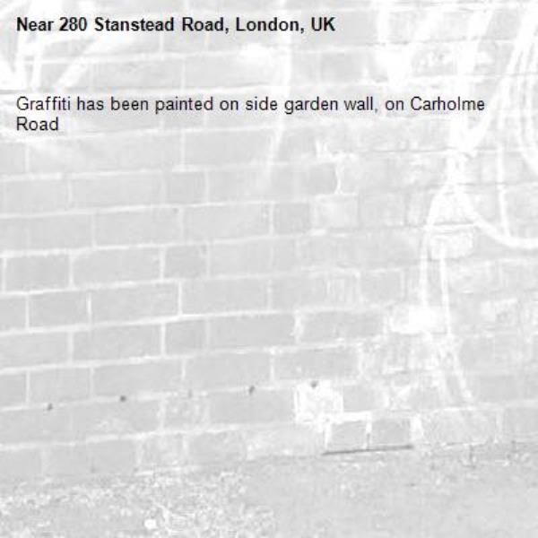 Graffiti has been painted on side garden wall, on Carholme Road-280 Stanstead Road, London, UK