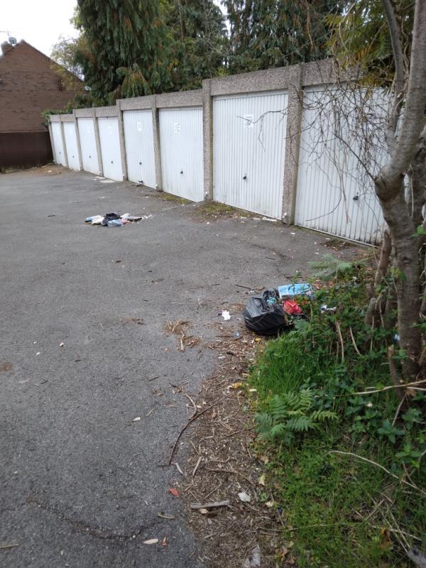 Bags of rubbish dumped in front of garages op 50 lesford -50 Lesford Road, RG1 6DX, England, United Kingdom