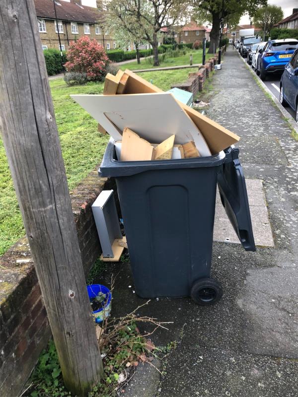 Outside no 50. Please clear Abandoned refuse bin full of wood-48 Gareth Grove, Bromley, BR1 5EQ