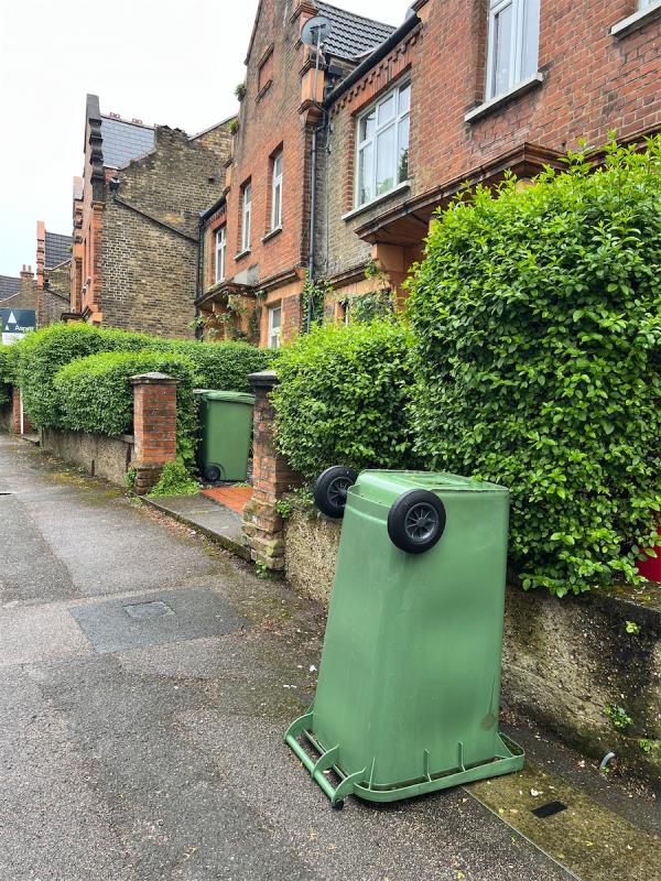 A green wheelie bin without a lid has been outside 28 Peak Hill, Se26 4LR for weeks. Bin collectors will not take it but just turned it upside down. Please could it be removed?-28 Peak Hill, London, SE26 4LR