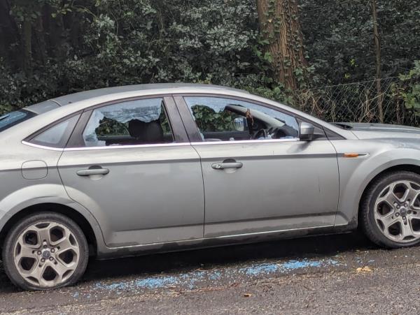 Dumped car with windows smashed in at the end of Yeovil rd near park entrance -22 Yeovil Road, Farnborough, GU14 6LB