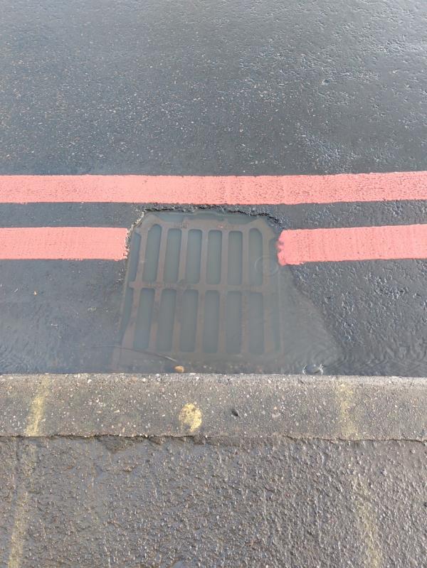 Bloked Road drain. Reported before, many times.-134 Norcot Road, Tilehurst, Reading, RG30 6BT