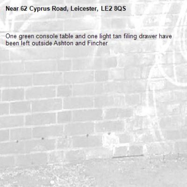 One green console table and one light tan filing drawer have been left outside Ashton and Fincher-62 Cyprus Road, Leicester, LE2 8QS