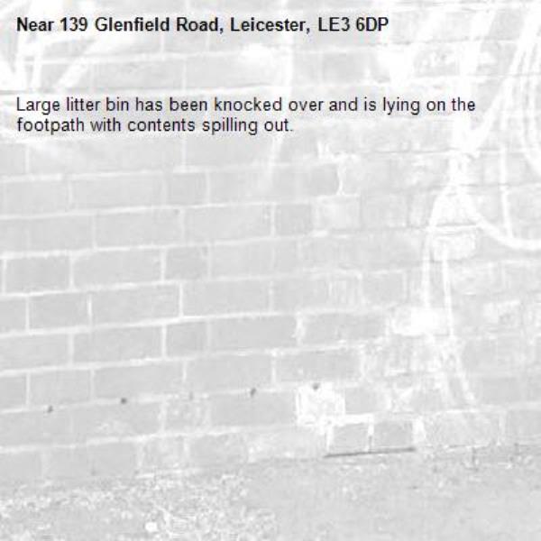 Large litter bin has been knocked over and is lying on the footpath with contents spilling out.-139 Glenfield Road, Leicester, LE3 6DP