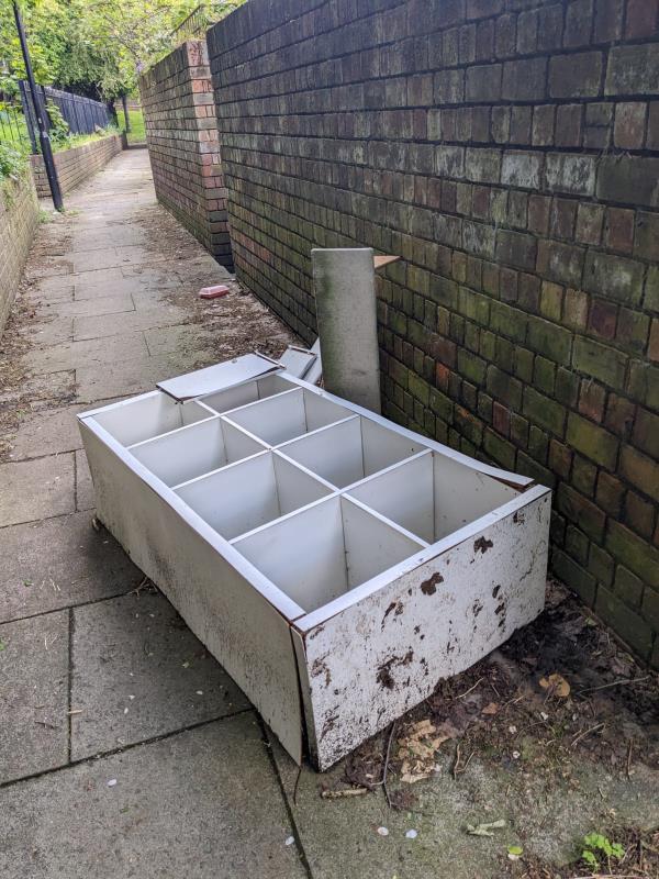 Large cabinet fly-tipped in the path between 72 Gilmore Road and Gilmore Road park.-72 Gilmore Road, Hither Green, London, SE13 5AA