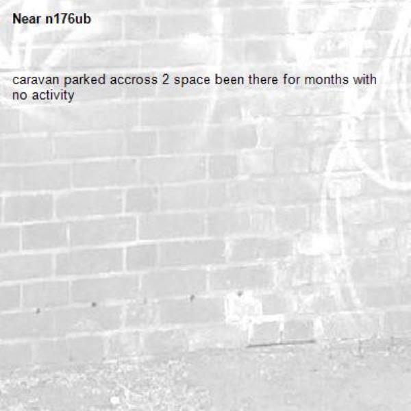 caravan parked accross 2 space been there for months with no activity-n176ub