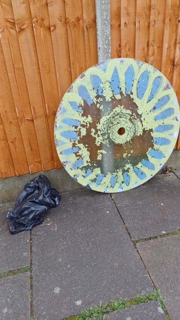 Large circular object and something in a black bin liner have been left on the pedestrian.-35 Laburnum Road, Leicester, LE5 1FQ