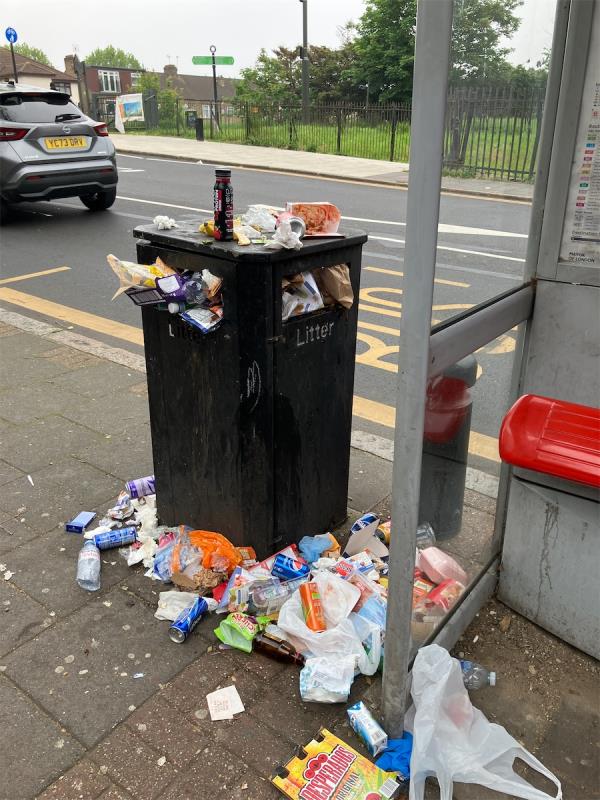 Bin full to the tops by floor really bad by bus stop !! -The Broadway, London
