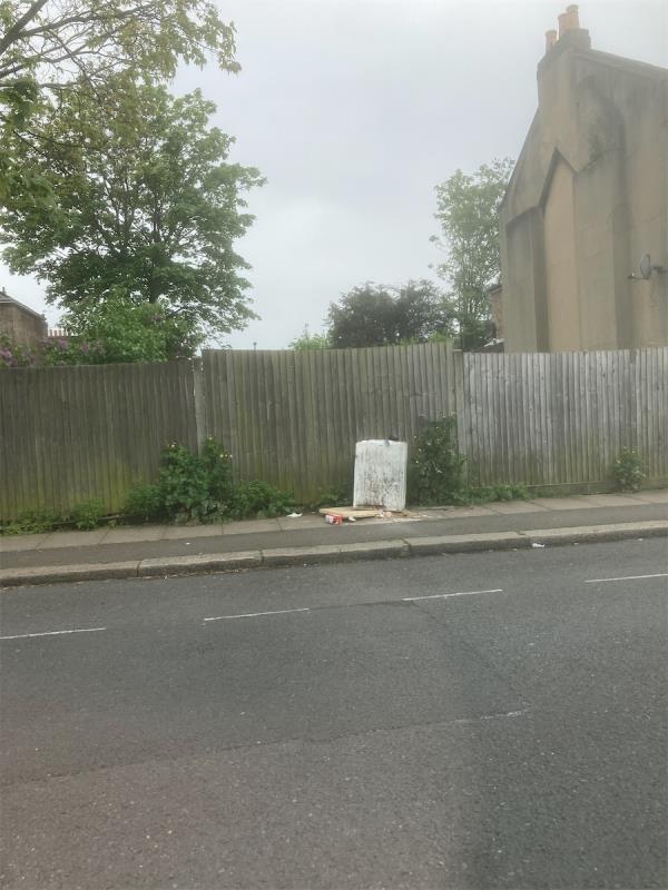 Broken freezer and rubbish fly tipped in street-51 Holbeach Road, London, SE6 4TG