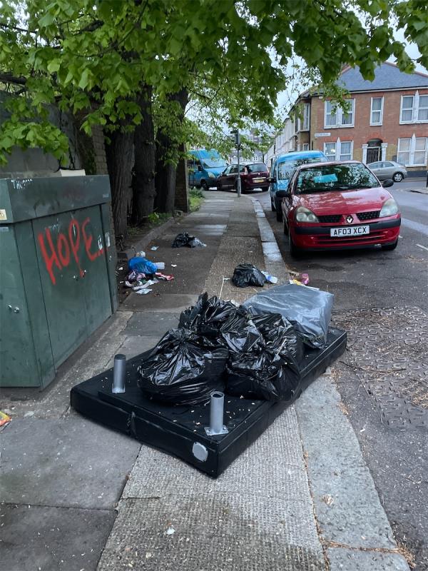 Bed and wood and rubbish on street -2A, Wyatt Road, Forest Gate, London, E7 9NE