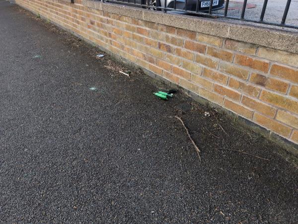 Broken glass spanning the width of the pavement.-747 Welford Road, Leicester, LE2 6HX