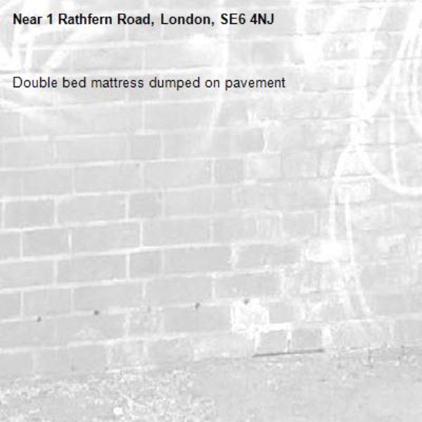 Double bed mattress dumped on pavement -1 Rathfern Road, London, SE6 4NJ