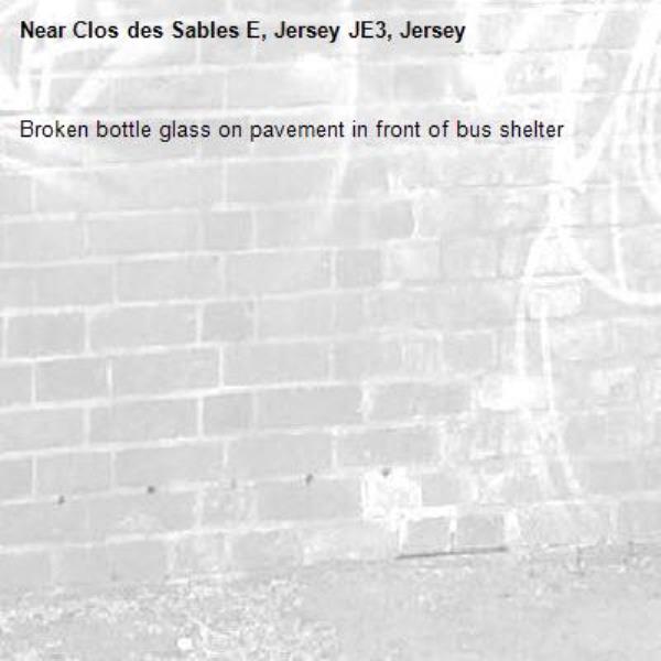 Broken bottle glass on pavement in front of bus shelter -Clos des Sables E, Jersey JE3, Jersey