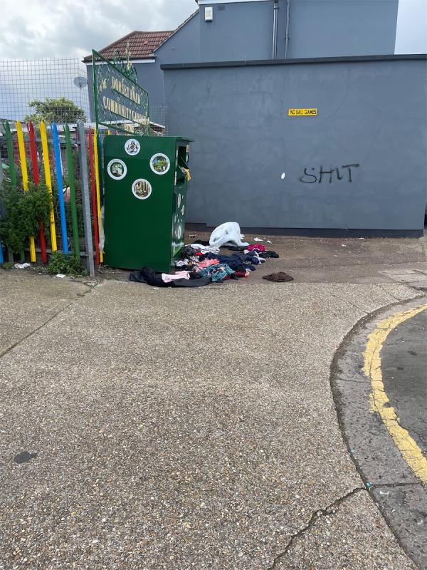 Clothes dumped outside bank -8 Washington Road, East Ham, London, E6 1AJ